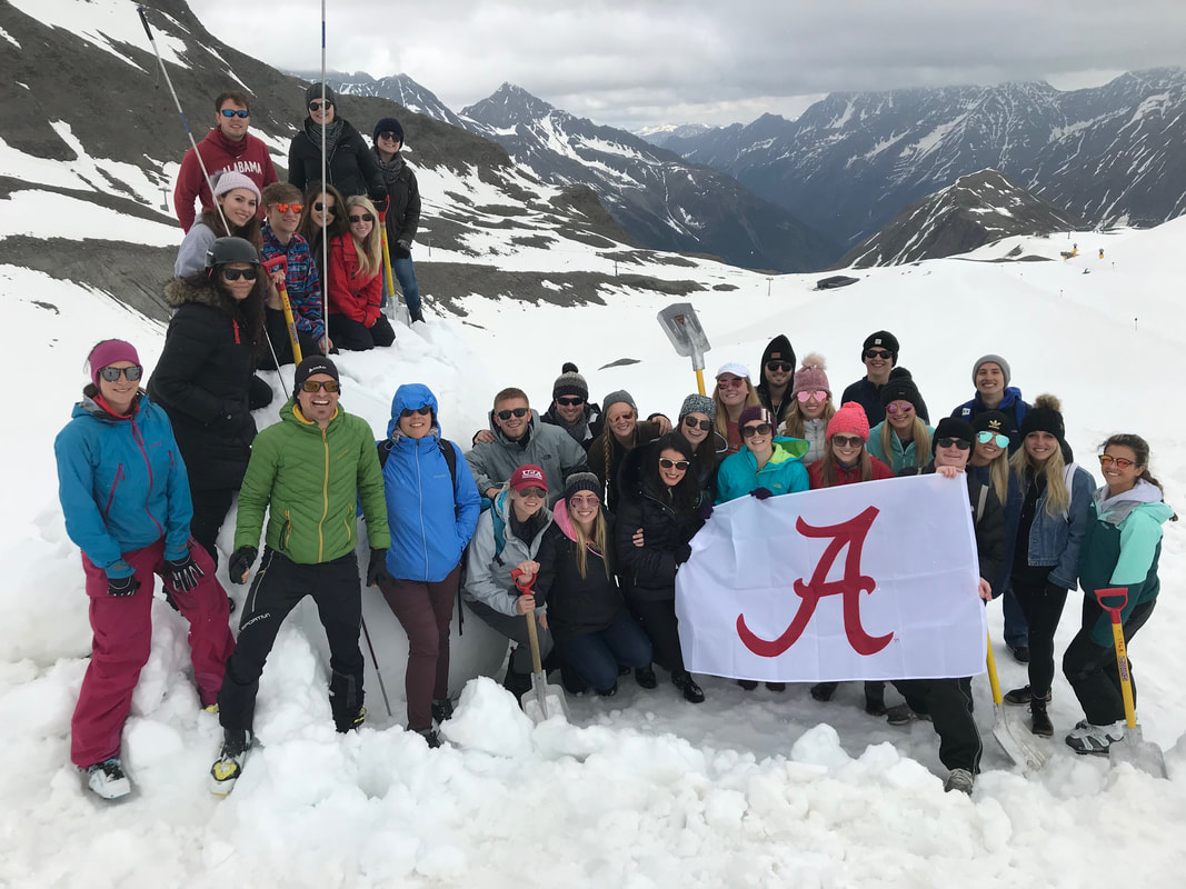 undergraduate students in Dr. Davis's study abroad course hiking and sampling on glacier